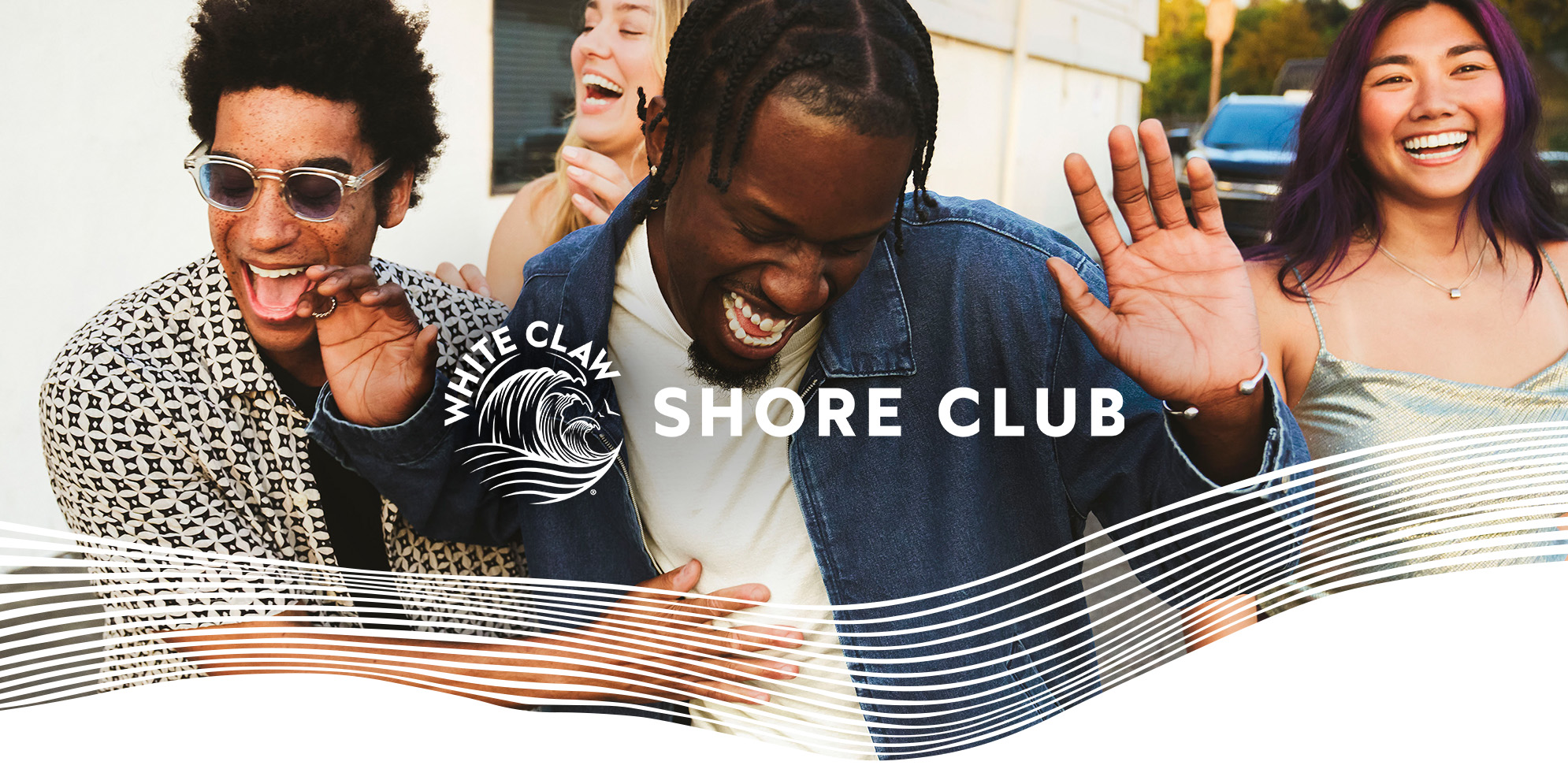Three friends laugh and enjoy themselves outdoors, with the White Claw Shore Club logo and wave graphic overlaid on the image.